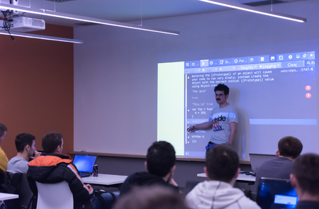 young computer technology students on  code programming class have presentation