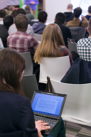 it students on workshop  listening  presentation and taking notes on laptop computerの写真素材