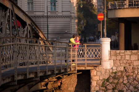 healthy young  couple jogging in the city  at early morning with sunrise in backgroundの写真素材