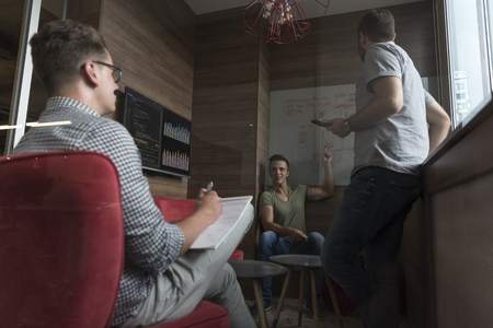 young people group in small private office have team meeting and brainstorming while working on...