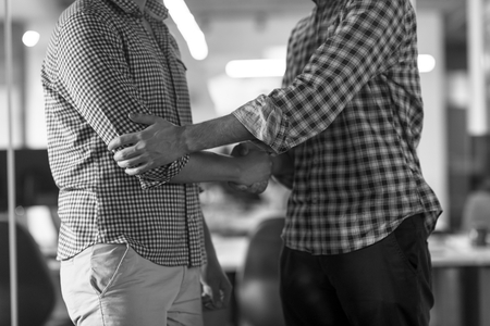 start up business people  handshake on team meeting  at modern business office interiorの写真素材