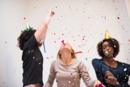 confetti party happy young people group celebrating new year eve while dancing and have fun at home