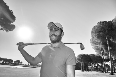 handsome middle eastern golfer portrait at golf course black and whiteの写真素材