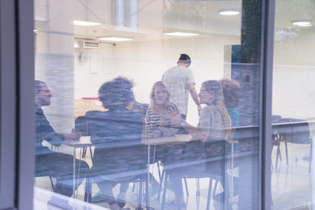 Multiethnic startup business team on meeting in modern bright office interior brainstorming, working...
