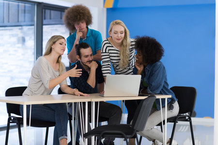 Multiethnic startup business team on meeting in modern bright office interior brainstorming, working...