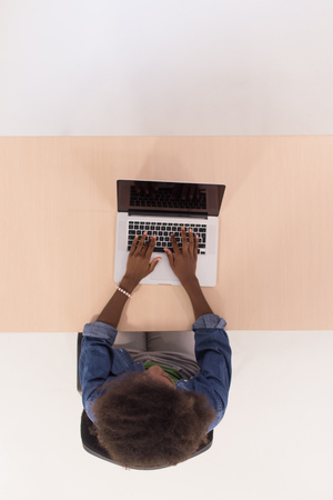Top View Of young african american informal Businesswoman Working At Computer In Officeの写真素材