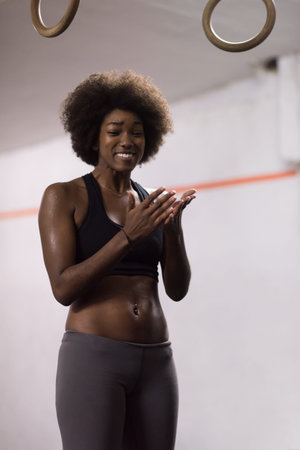 Fitness dip ring beautiful young african american woman workout at gym dipping exerciseの写真素材