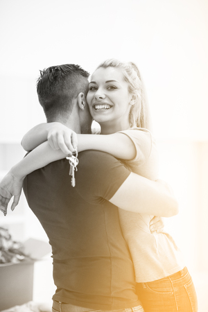 excited happy young couple looking forward to moving into a new homeの写真素材
