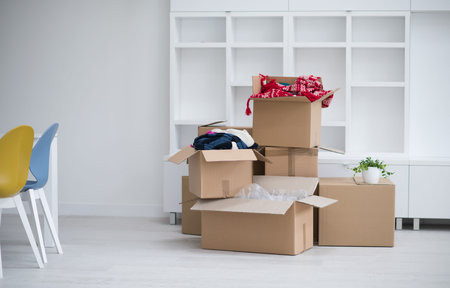 Moving boxes in empty roomの写真素材