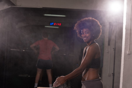 Gym Chalk Magnesium Carbonate hands clapping young african american woman for climbing workout