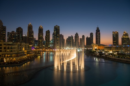 DUBAI UAE 31 JANUARY 2017 famous musical fountain in Dubai with skyscrapers in the background on a beautiful summer eveningのeditorial素材