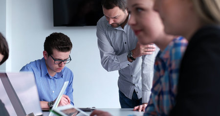 Group of business people discussing business plan  in the office