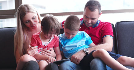 Happy Young Family Playing Together at home