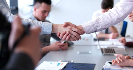 Business Partner Shake Hands on meetinig in modern office buildingの写真素材