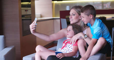 Happy Young Family Playing Together at homeの写真素材