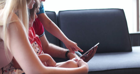 Happy Young Family Playing Together at homeの写真素材