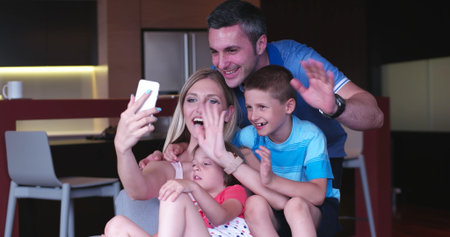 Happy Young Family Playing Together at homeの写真素材