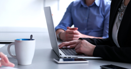 business people having meeting in bright office making plans for businessの写真素材