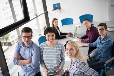 group of business people preparing for next meeting and discussing ideas using digital tabletの写真素材