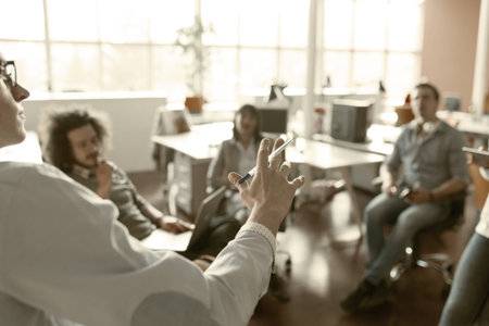 Group of a young business people discussing business plan  in the office