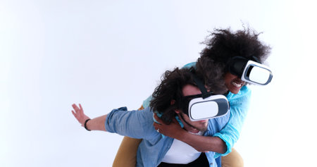 Happy multiethnic couple getting experience using VR headset glasses of virtual reality, isolated on...