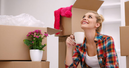 people, moving new place and repair concept   happy beautiful  young woman with many cardboard boxes...