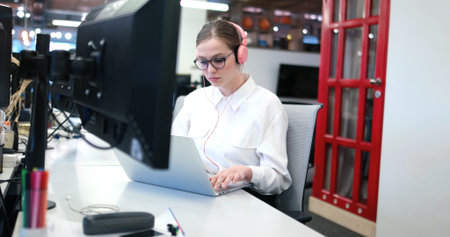 Young female Entrepreneur Freelancer Working Using A Laptop In Coworking space