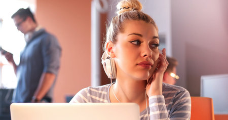 Young female Entrepreneur Freelancer Working Using A Laptop In Coworking spaceの写真素材