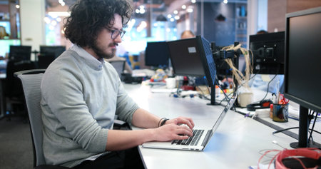 Young Entrepreneur Freelancer Working Using A Laptop In Coworking space