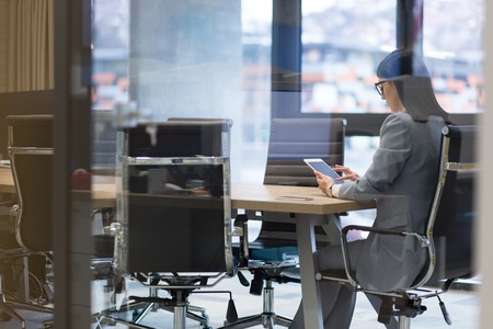 Businesswoman using tablet at the work in officeの写真素材