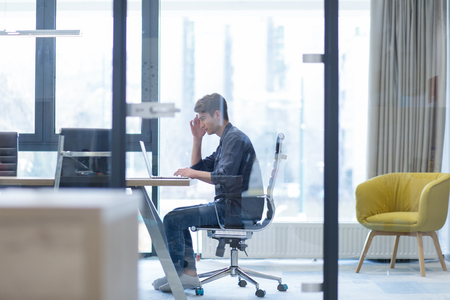 Young Entrepreneur Freelancer Working Using A Laptop In Coworking spaceの写真素材