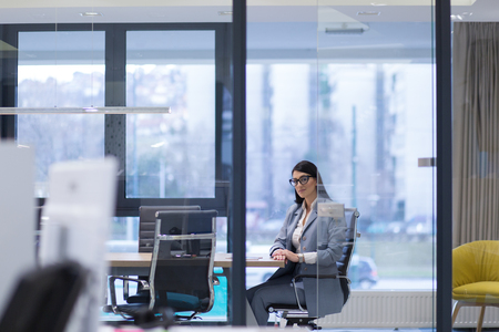 Businesswoman using tablet at the work in officeの写真素材