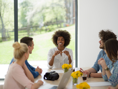 Multiethnic Group of business people discussing business plan  in the startup officeの写真素材