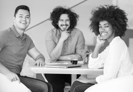 Young team talking about the problem at workの写真素材