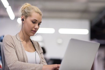 Young female Entrepreneur Freelancer Working Using A Laptop In Coworking spaceの写真素材