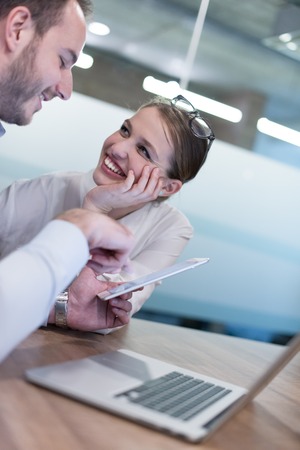 startup business team preparing for next meeting and discussing ideas using digital tabletの写真素材