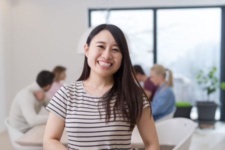 Group of a young business people discussing business plan at modern startup office buildingの写真素材