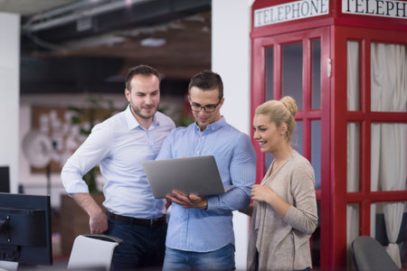 startup business people using laptop preparing for next meeting and discussing ideas in creative officeの写真素材