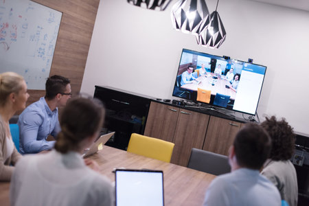 Group of a young business people discussing business plan at modern startup office building