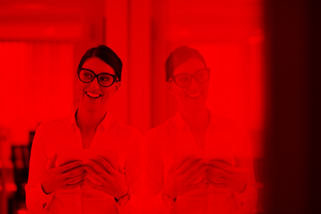 Pretty Businesswoman Using Tablet In front of startup Office Interiorの写真素材