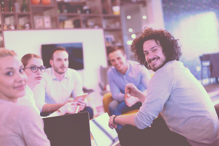Group of a young business people discussing business plan at modern startup office buildingの写真素材