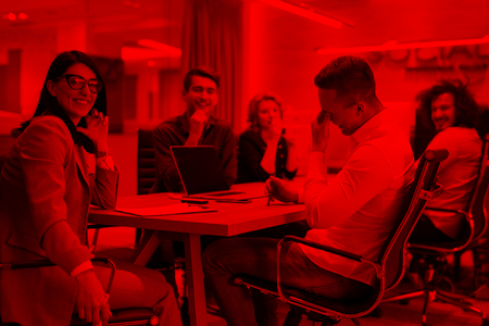 Group of a young business people discussing business plan at modern startup office buildingの写真素材