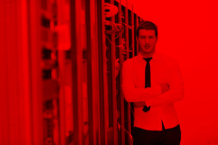 young handsome business man it  engeneer in datacenter server roomの写真素材