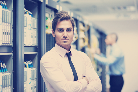 group of young business people it engineer in network server room solving problems and give help and supportの写真素材