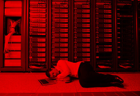business man in network server room have problems and looking for  disaster solution