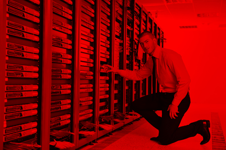 young handsome business man  engeneer in datacenter server roomの写真素材