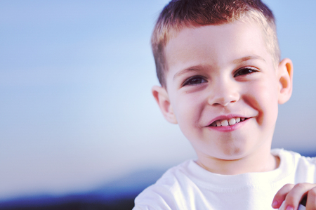 happy young boy child outdoor portraitの写真素材