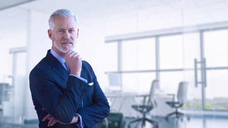 Portrait of senior businessman in front of his modern office