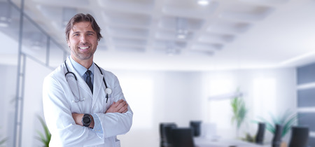 Portrait of smilling senior doctor of medicine in his ordinationの写真素材
