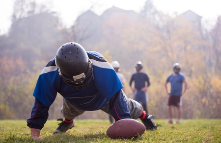 young american football player in action during the training at fieldの写真素材